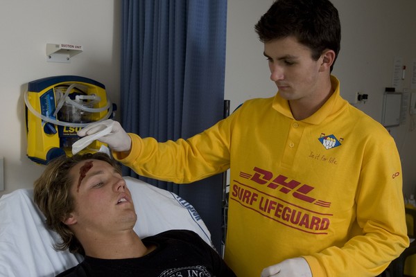 Surf Lifeguard administers first aid